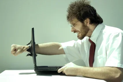 man-punching-computer.webp