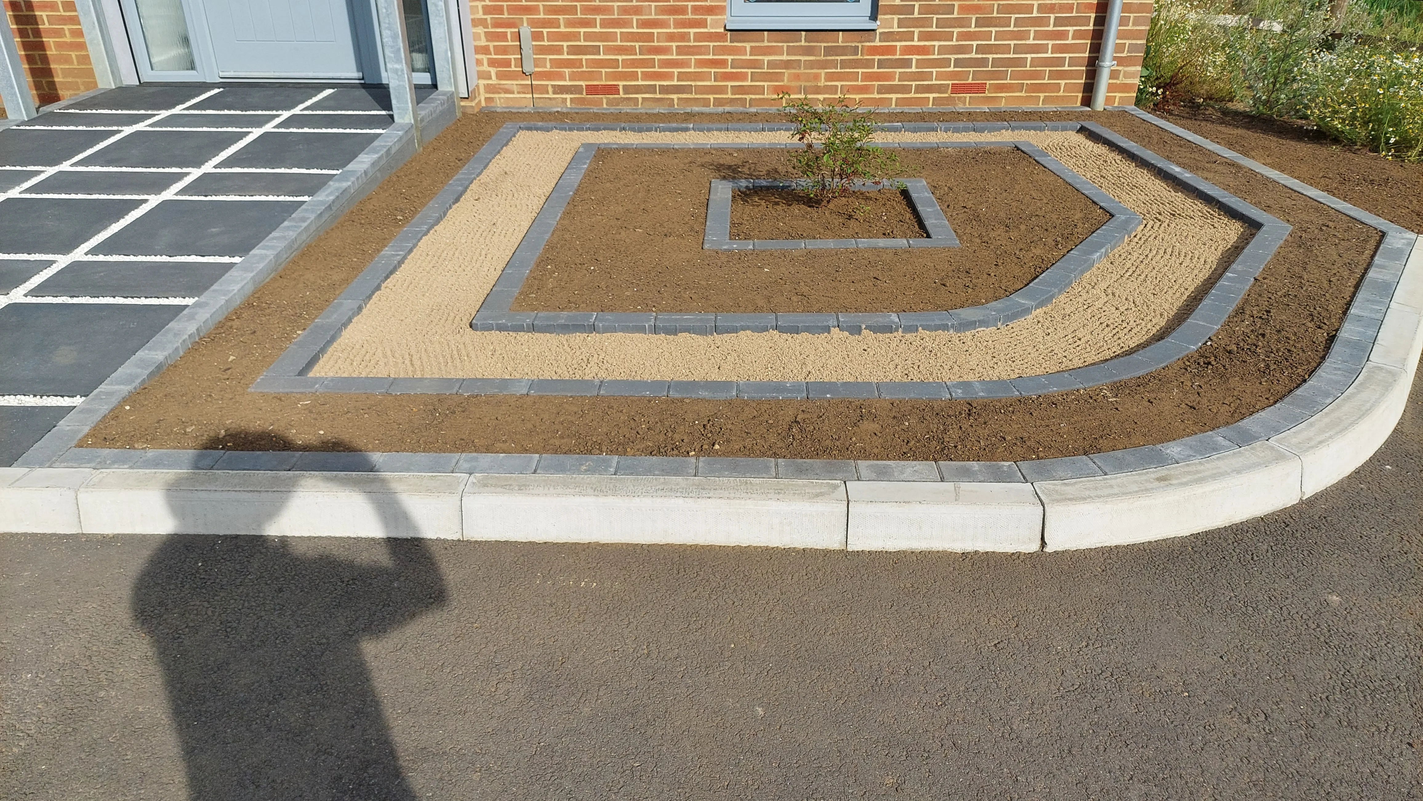 Hard landscaping completed - left side